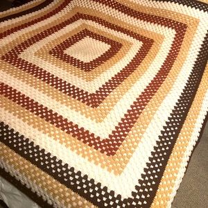 Afghan in a square pattern on brown tones
